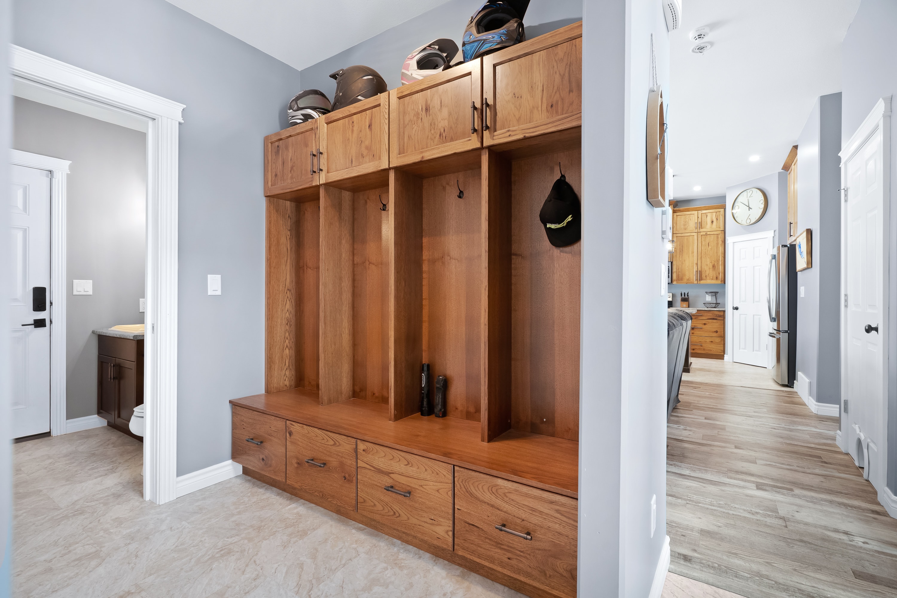 Lake house mudroom with custom wood storage cabinetry